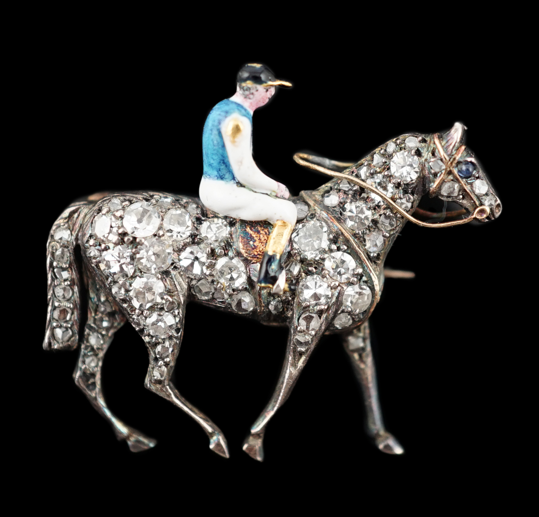 A late Victorian gold, rose cut diamond and polychrome enamel set horse and jockey brooch